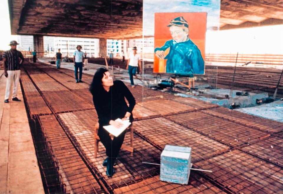 Lina Bo Bardi next to one of her cavaletes on the museum construction site. From Domus 999, February 2016
