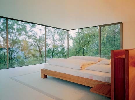 The main bedroom floats gently in the landscape at the top level