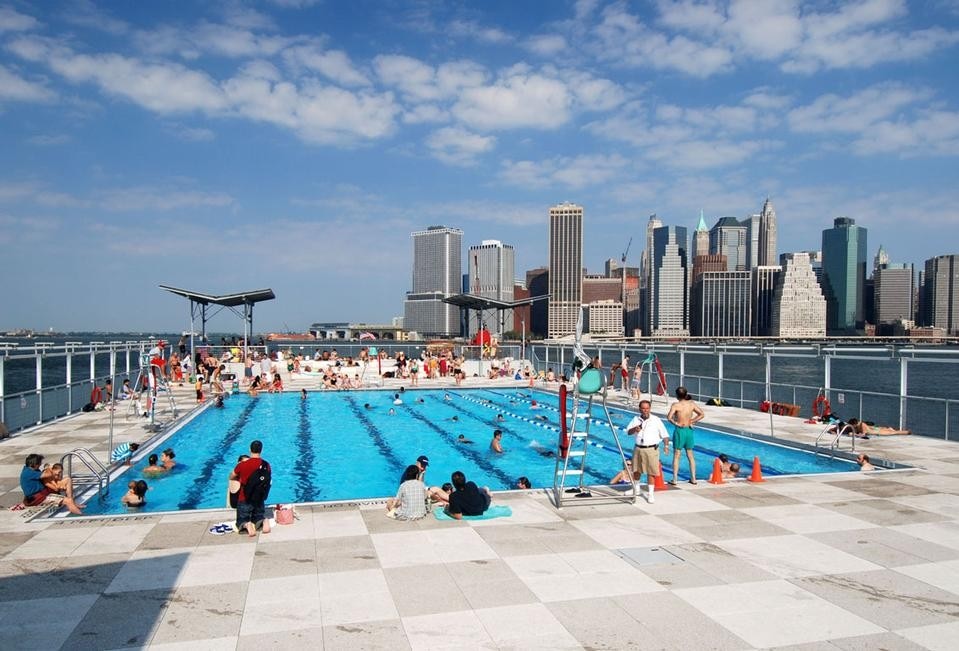 The Floating Pool, a mobile swimming pool designed by Jonathan Kirschenfeld Associates, adaptively reuses a decommissioned cargo barge to bring summertime recreation to underserved populations of New York City 