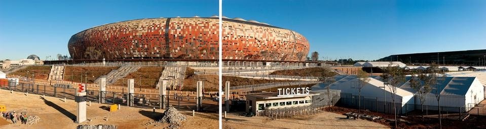 The Soccer City Stadium is located in
Nasrec, a suburb halfway between Soweto and
downtown Johannesburg. North of a major
transportation interchange, the stadium is
served by a public walkway that connects it
with a trade fair complex: the Johannesburg
Expo Centre. Built in 1987 to serve the
community of Soweto, it was originally called
the First National Bank Stadium. Between
2007 and 2010, it was completely renovated
and enlarged to accommodate the World
Cup football tournament