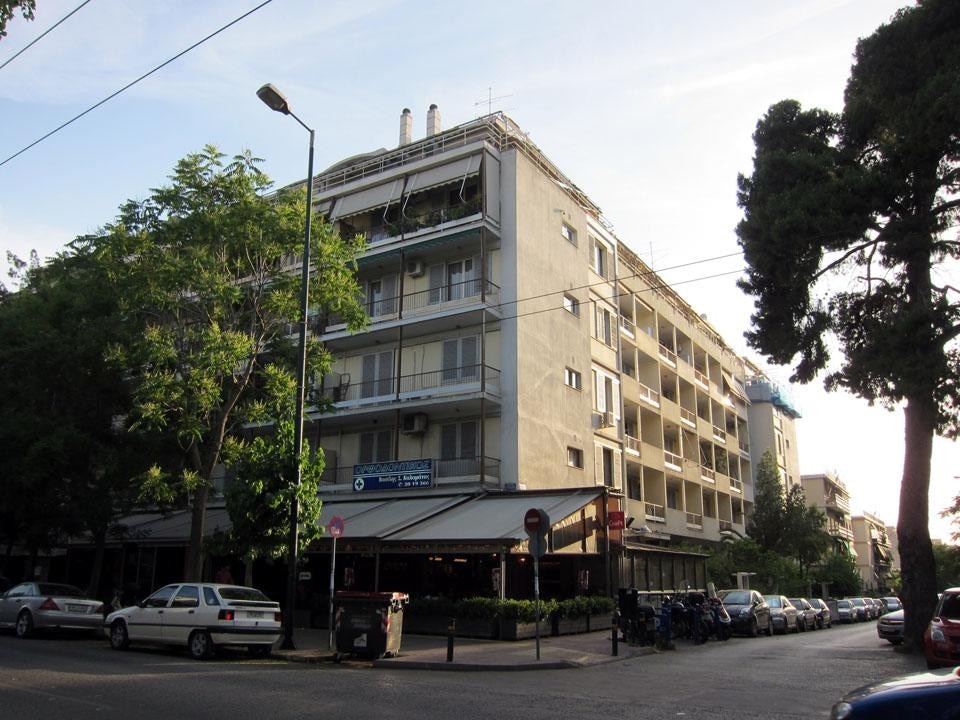 A recent image of Chara, the largest housing block in downtown Athens. It is also one of the few <i>polykatoikies</i> with a habitable courtyard, a little garden and a playground.