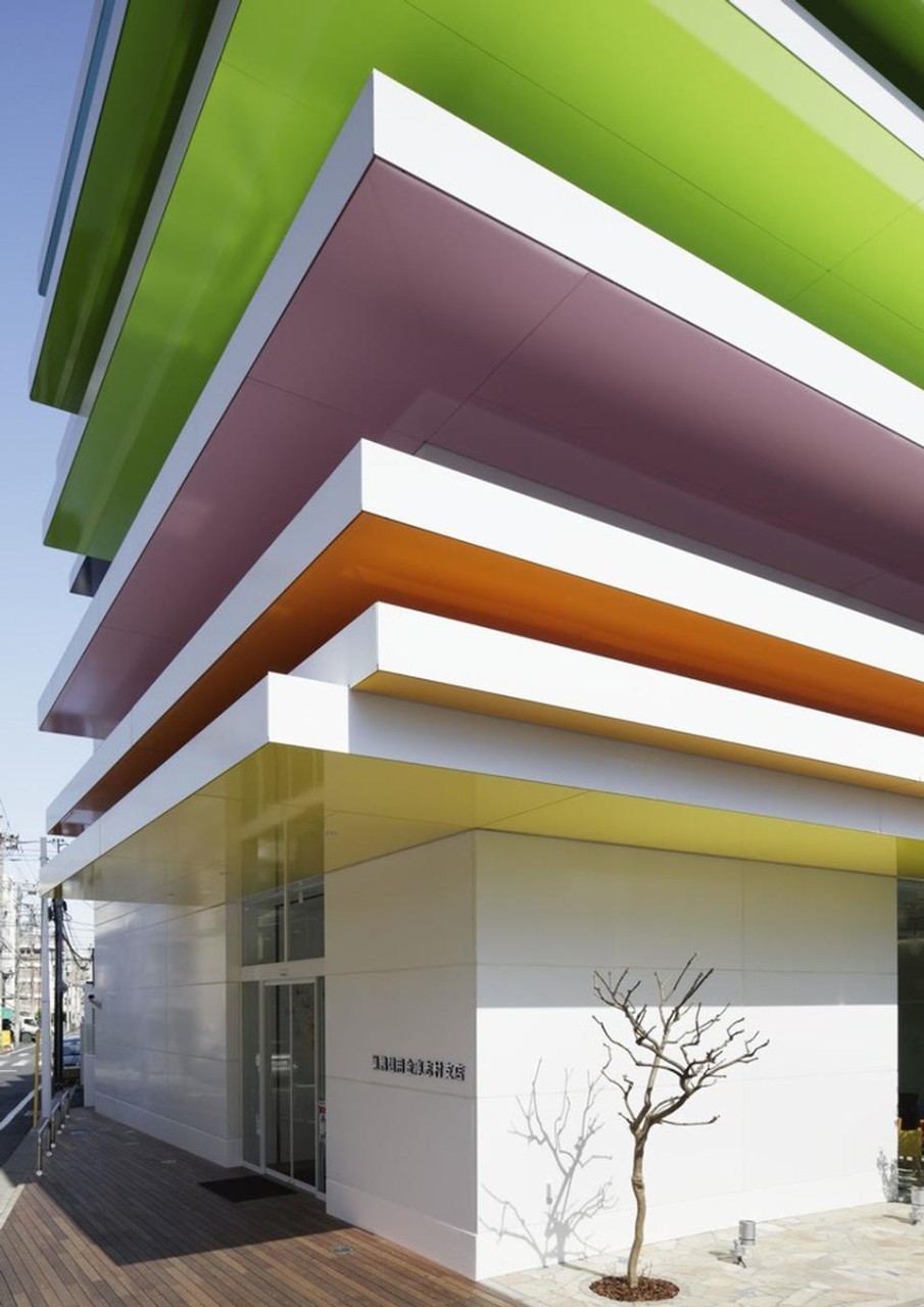 12 layers of rainbow colors greet visitors outside the building.