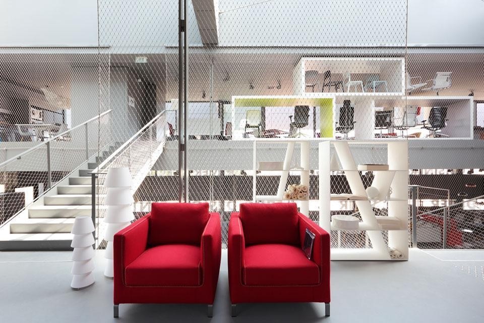 The B&B Italia showroom area: <em>Ray</em> armchairs, designed by Antonio Citterio; and <em>Shelf</em> bookcases designed by Naoto Fukasawa. Photo by M. Lucat