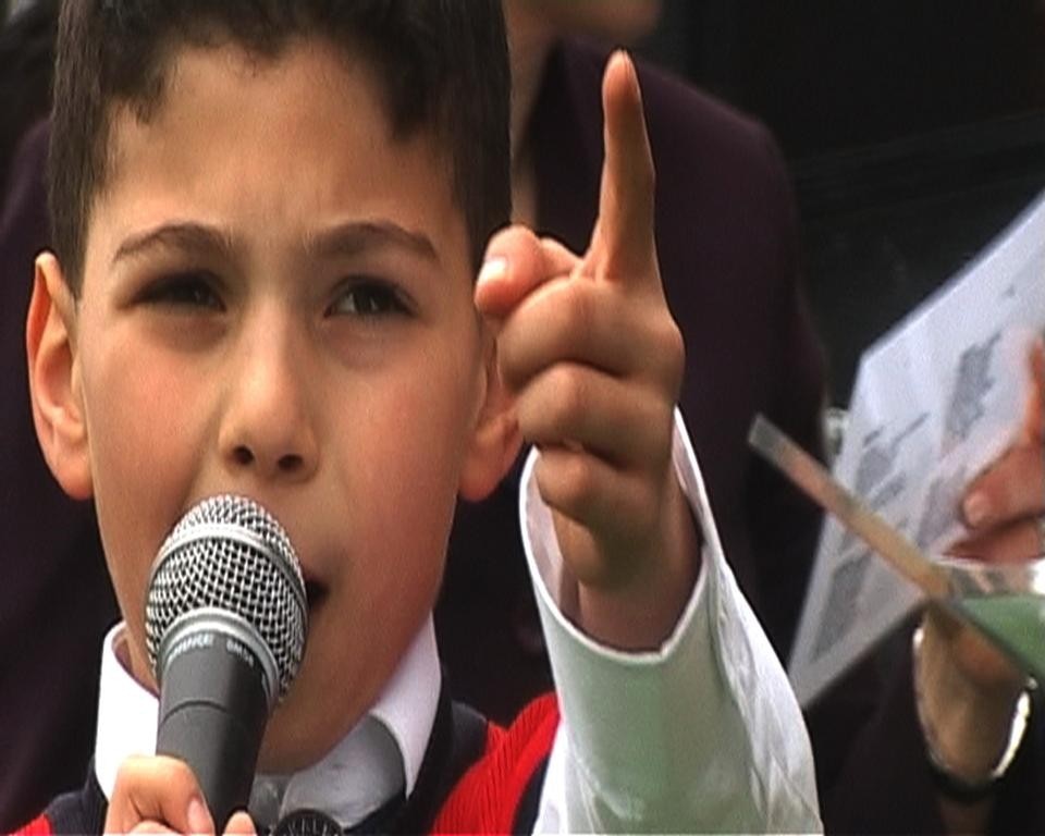 The video <i>The Flag</i> by Köken Ergun is the second part of a series on state ceremonies of the Turkish Republic. It was shot April 23 during the Day of the Child, which marked the inauguration of the new Turkish parliament.