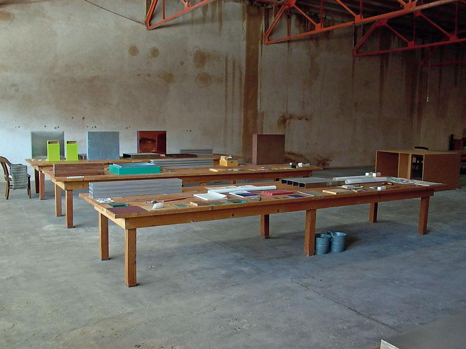 Inside Donald Judd’s Art Studio in Marfa, Texas.
The artist acquired this former grocery shop in 1990 and turned it into a studio with long work tables and shelves displaying prototypes designed by Judd and samples for production. Judd Art/Works © Judd Foundation by VAGA, NYC/SIAE, Italy. 