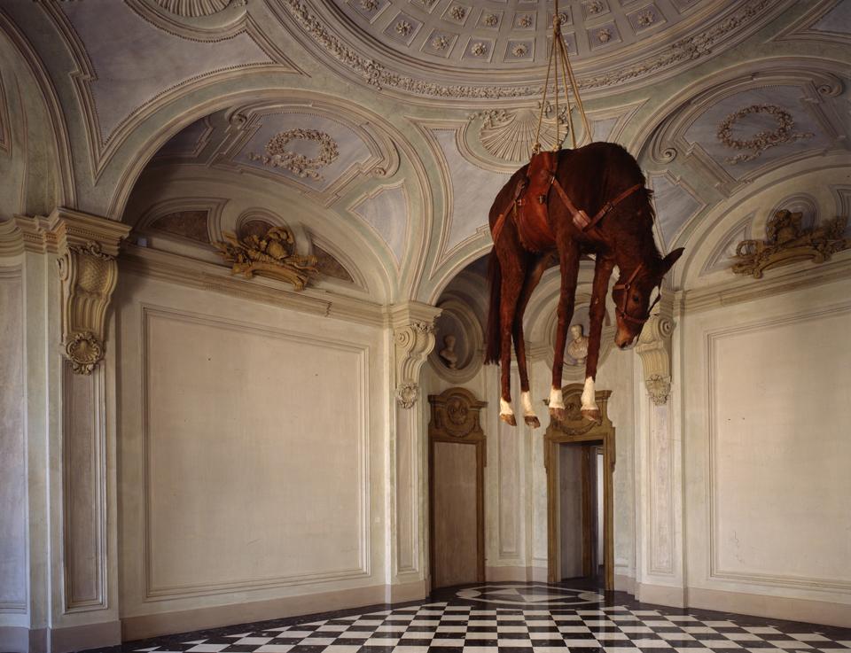 Maurizio Cattelan, <i>Novecento,</i> 1997. Stuffed horse, saddle leather, rope and pulley. © Maurizio Cattelan. Photo of Paulo Pellion di Persano, courtesy of the artist.
