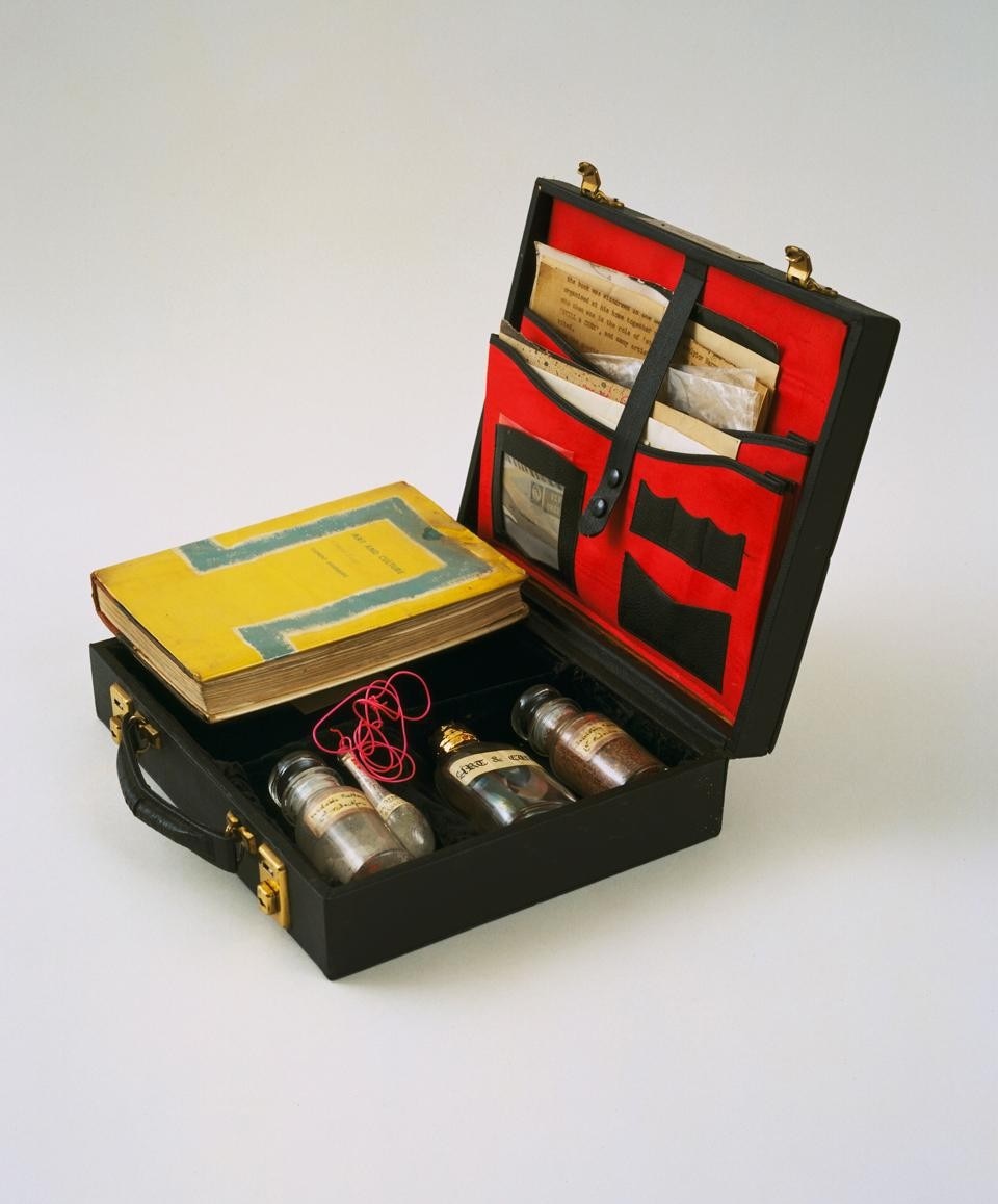 John Latham, <em>Art and Culture</em>, 1966–69.
Leather case containing book, letters, photostats, and labeled vials
filled with powders and liquids. The Museum of Modern Art, New York; Blanchette Hooker Rockefeller Fund. © 2011 John Latham. Digital image: © The Museum of Modern Art/Licensed
by SCALA/Art Resource, NY