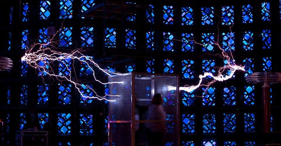 Electric arcs and experimental effects produced by the combined use of Tesla coils and a Faraday cage.