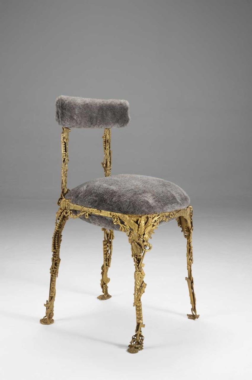 Fernando and Humberto Campana, <em>Brazilian Baroque Collection</em> for the Roman O Gallery. The collection features a sofa and chair with a bombastic, hyper-decorated, gilded-bronze structure that at first glance conjures up Louis IV. Upon closer inspection, you catch sight of jungle animals, here welded in silver, that have always marked the two brothers' work