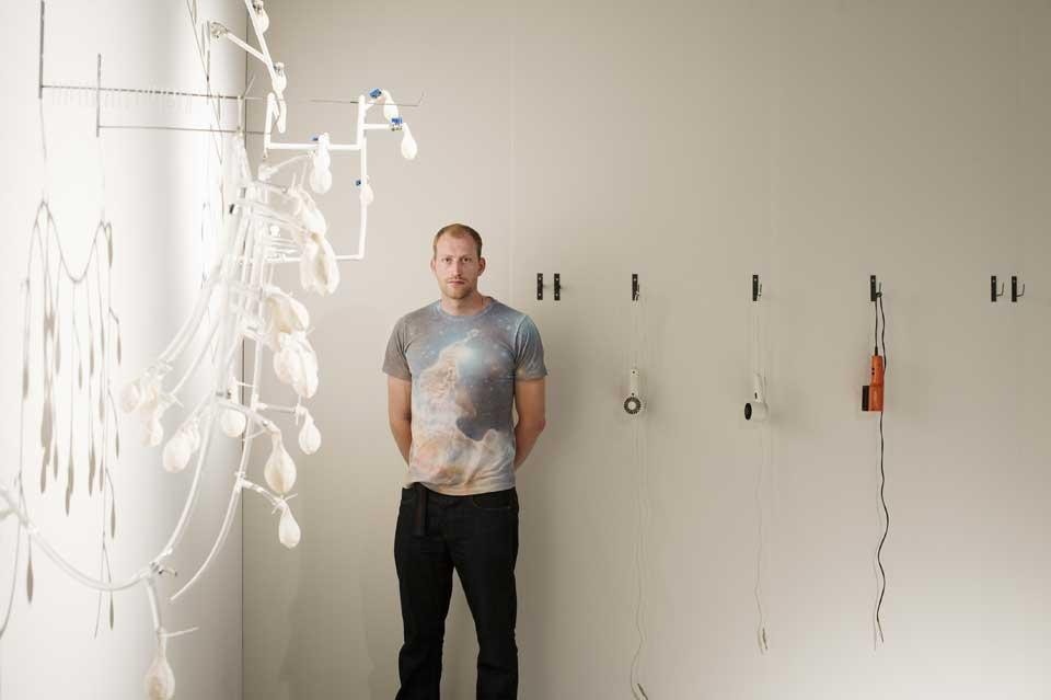 2012 Designer of the Future Tom Foulshaw stands next to his <em>Totem</em> project