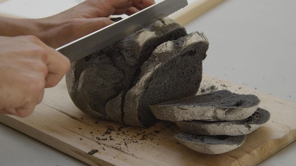 During the course of their performance, Formafantasma offered visitors a taste of charcoal bread