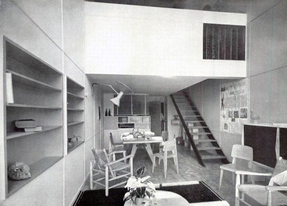 The living room of a typical dwelling unit; the interior staircase leads to the bedrooms.