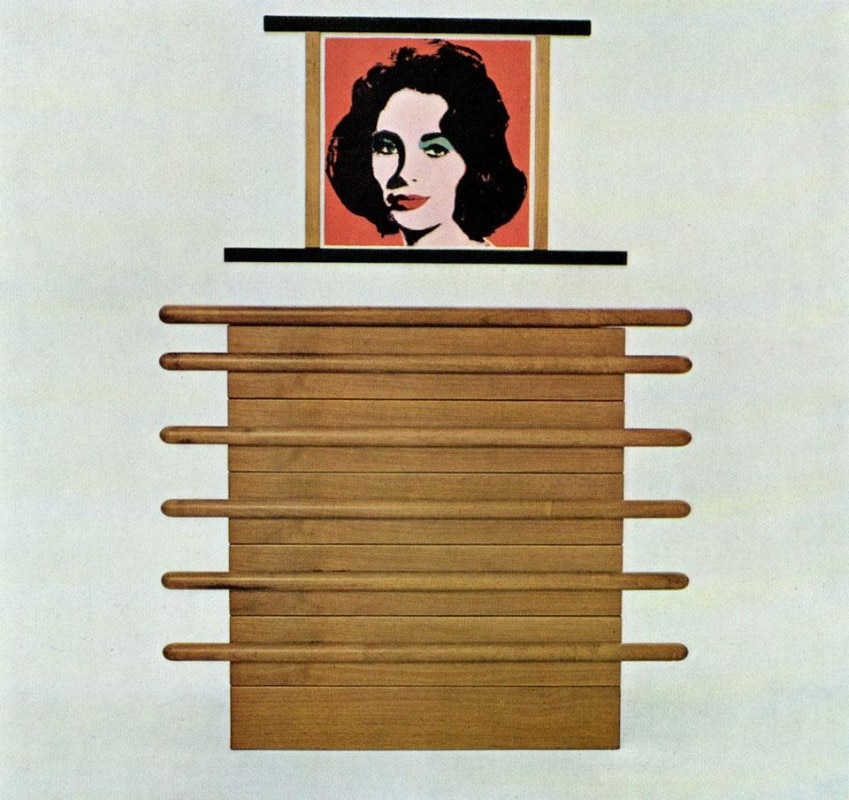 A chest of drawers for the bedroom in natural walnut; on the wall, a lithograph by Andy Warhol.