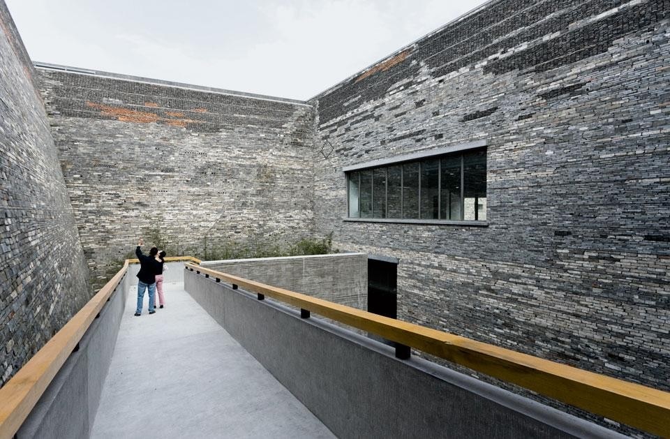 A series of open-air courtyards have been dug out of the inside of the building.