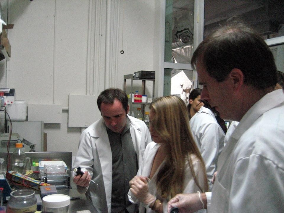 Dr. Oliver Medvedik (left) with students in the shared laboratory space used by ONE Lab students.
