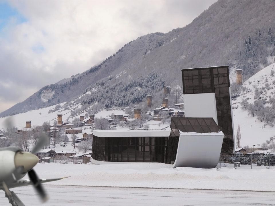 The building comprises two branches that curve up towards the sky and serves the local ski resort