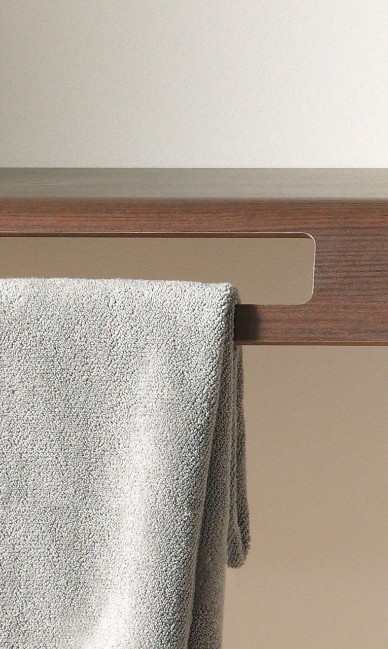 The consoles – in variable sizes – feature openings for towels in the panels or front surface.  