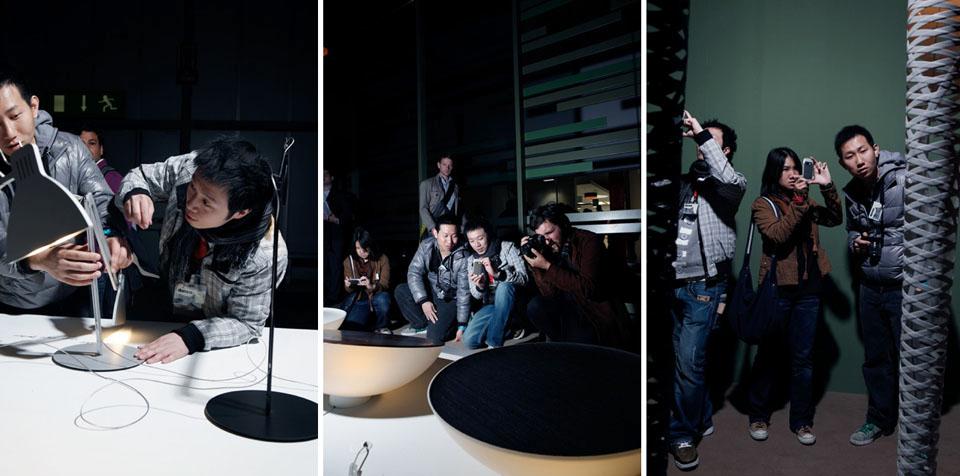 Domus Academy's students photographing the products on display at the Fair, at Euroluce