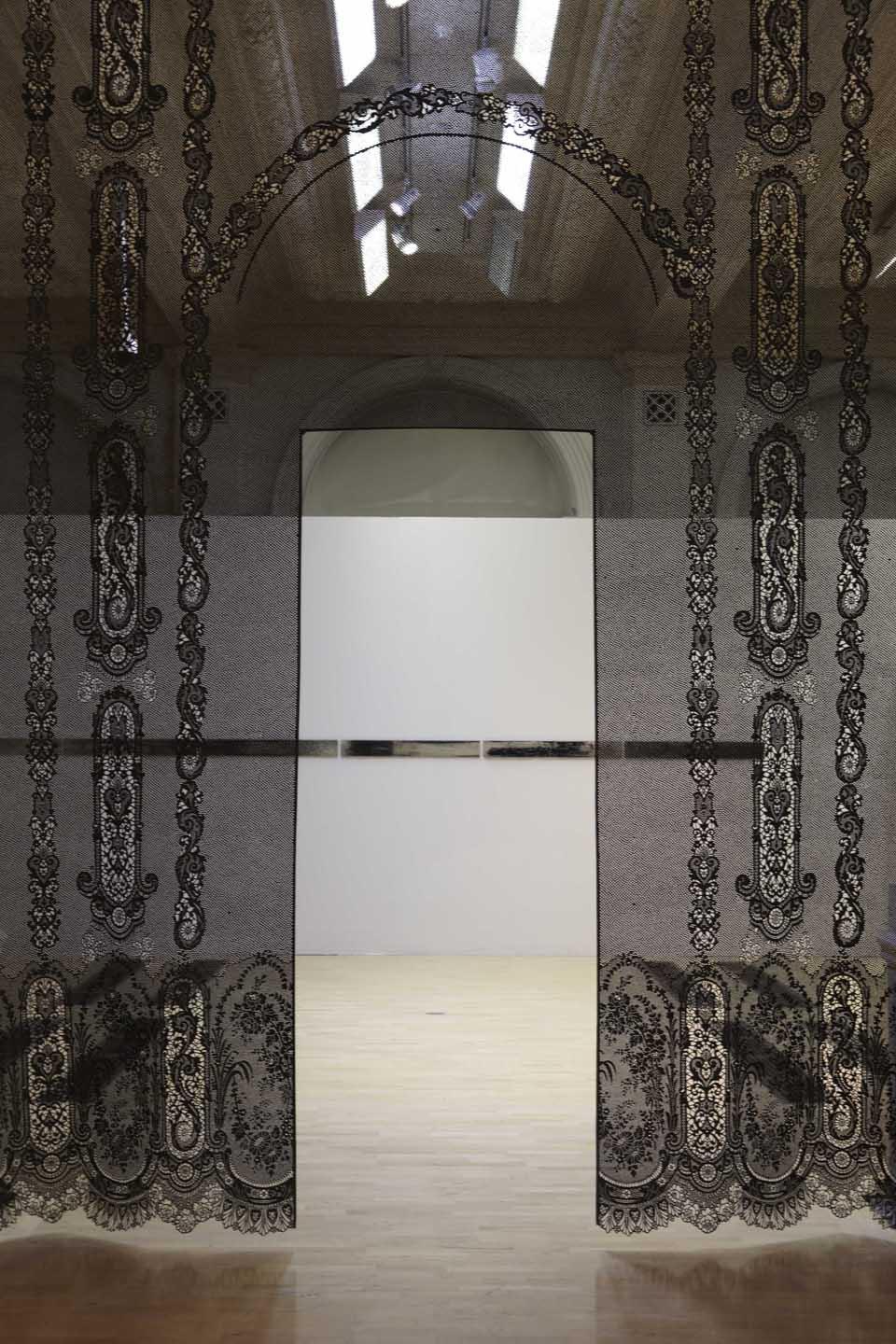 Piper Shepard (USA) has taken a piece of historic point de gaze lace from the BMAG
Collection as the starting point for a black hand-cut vellum piece that will be
installed between two internal gallery columns and opposite Bascoul’s large
white Moucharabieh screen
