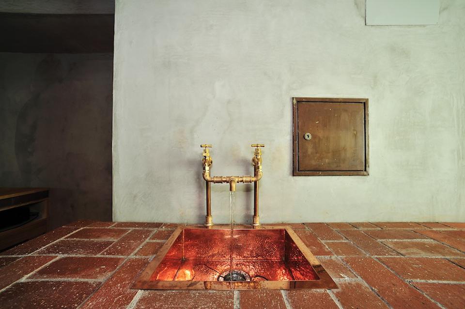 The bent copper demonstration sink pays homage to times when quality plumbing was treated with reverence. 