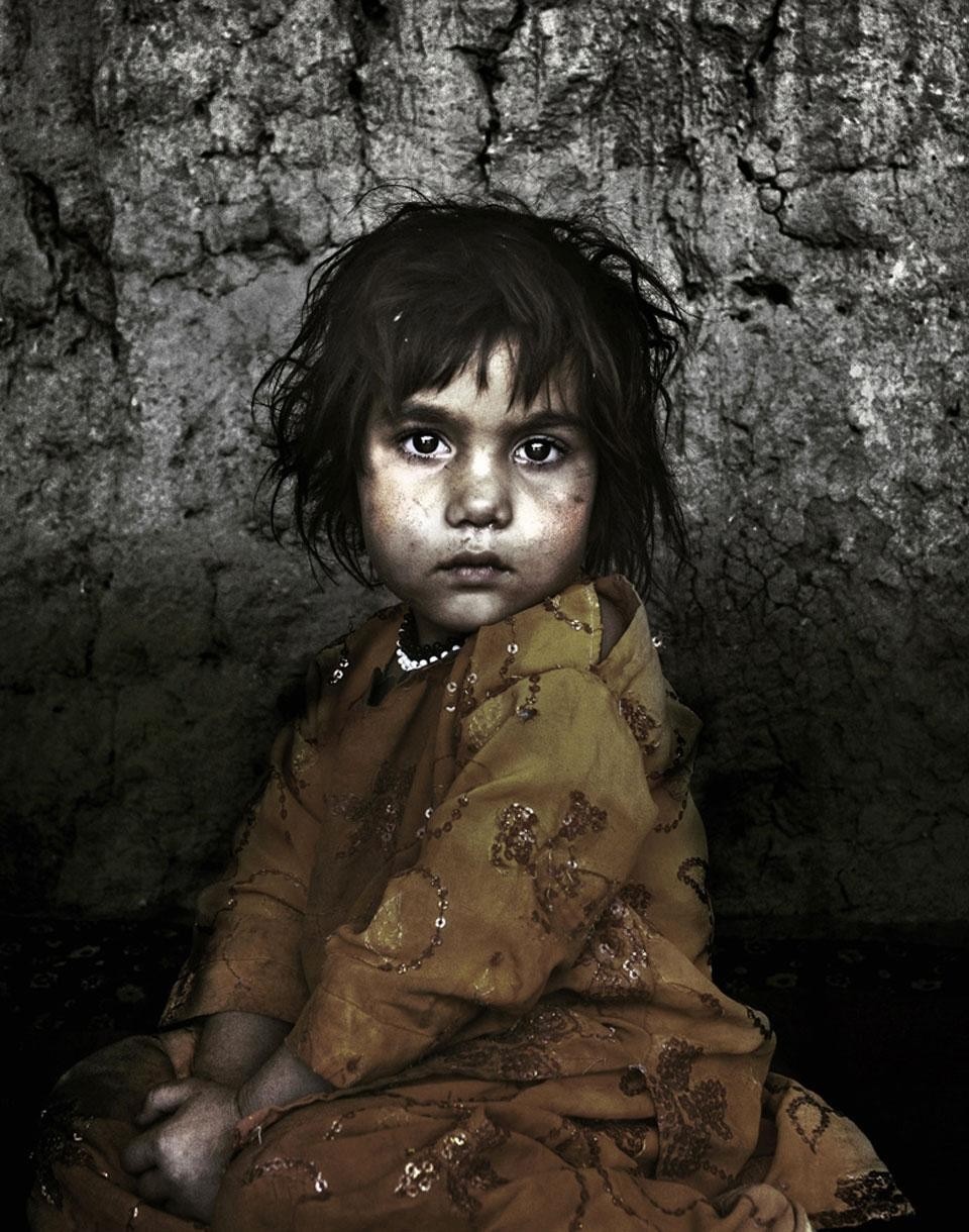 Four year-old Nazia was sold by her father to a 50 year-old man from the Helmand region for 800 dollars. The money was used to afford medicine for her older 8 year-old sister. Photo by Jon Wentzel
