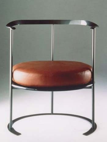 ‘Catilina’ armchair, 1958. Shaped forged iron frame, wooden seat with cushion
