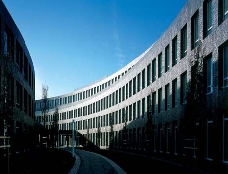 The two parts house distinct institutions: the smaller is allocated to infrastructure and services for businesses connected with the nearby airport