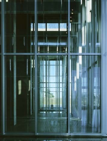 Contrasting blank walls with glass screens