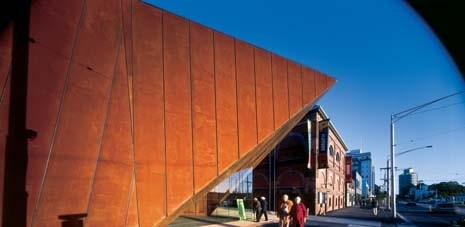 A Corten steel bow erupts into the Melbourne suburbs to mark the presence of the new gallery