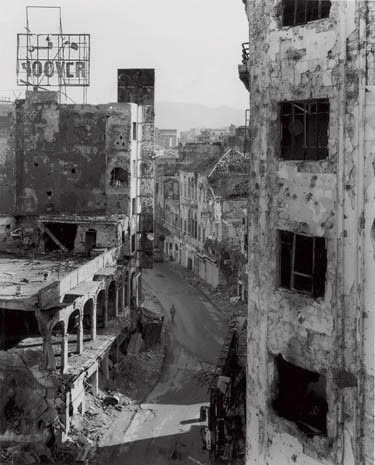 Gouraud Street pockmarked by shellfire photographed by Gabriele Basilico in 1993, above, are gradually being tidied up