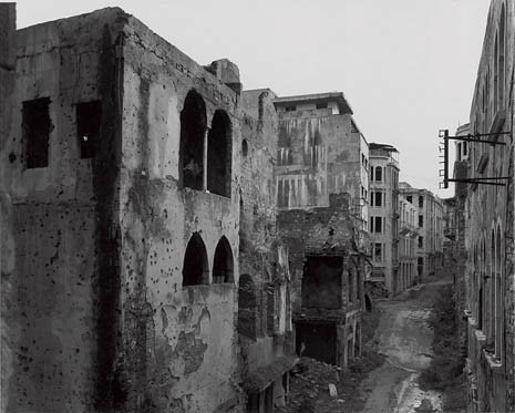 The apocalyptic desolation of the 1990s has been rendered safe for the conspicuous consumption of the present with pedestrian precincts and designer shopping: above and below, Abdel Malek Street before and after