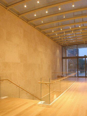 With an overall floor area of 54,000 square metres, the building is divided into 5 parallel pavilions: the three central ones house the exhibition galleries whilst the two outer ones contain a cafe and shop. Photography Ben Thorne 