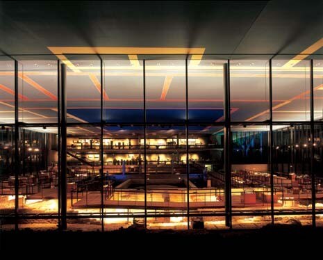 At night French lighting designer Yann Kersalé’s uplighters in the floor project shifting blue and green lights into the foliage