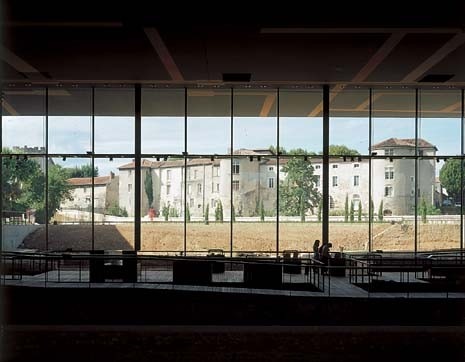 Framed by the museum’s north wall and easily capturing one’s attention when inside are the Renaissance and medieval buildings across the rail tracks