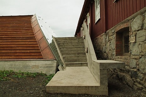 Details of the west wing where wood, glass and copper have been used as well as concrete cast in situ