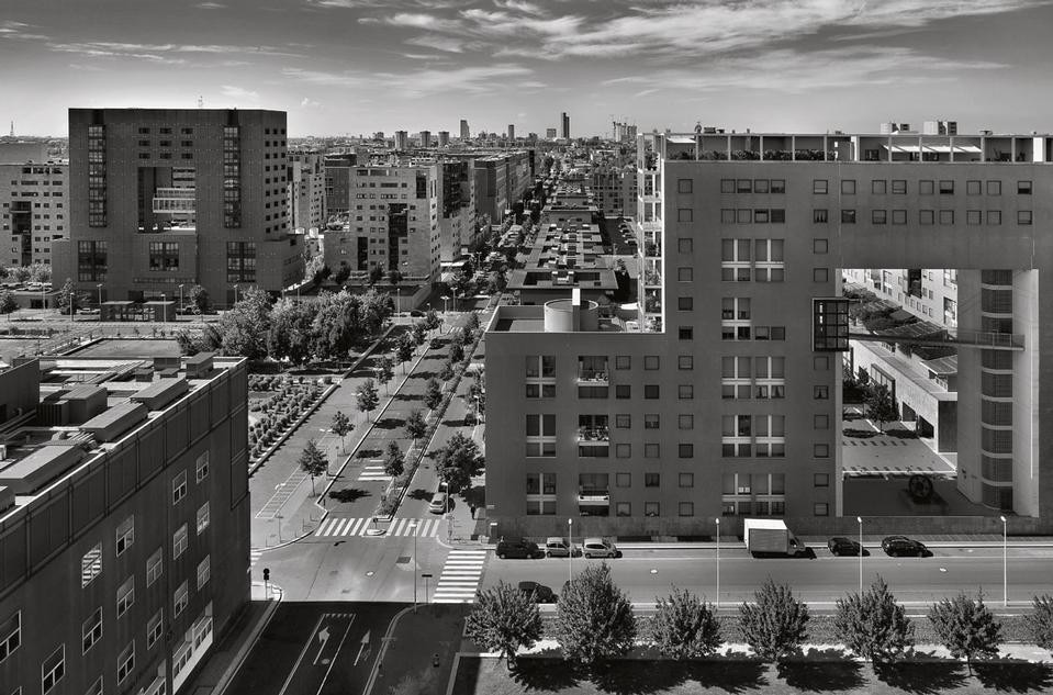 Aerial view of the
neighbourhood, with the tall buildings of
downtown Milan visible in the background