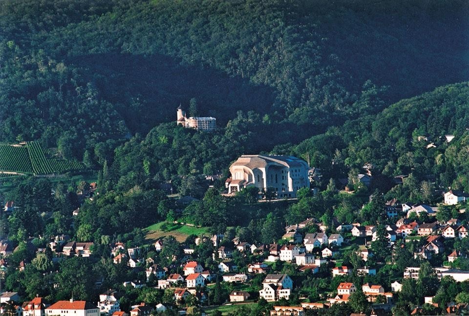 The second Goetheanum emerges conspicuously from the hilly context of Dornach.
