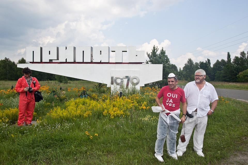 In front of Pripryat's town sign. Photograph by Neil Berrett.


