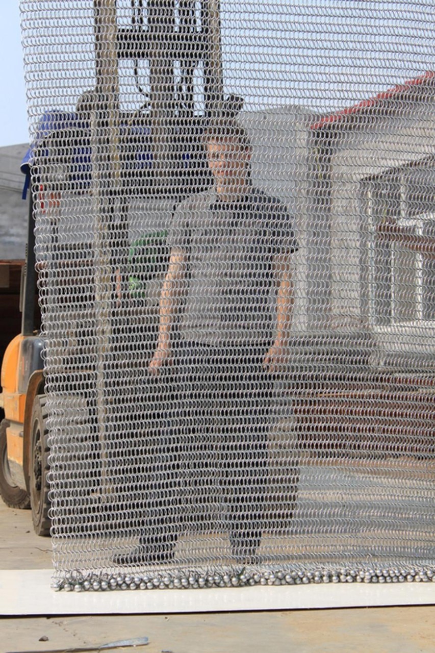 Jeffrey Kock of Front Inc, showing the transparency of the mesh. Photo by Front.


