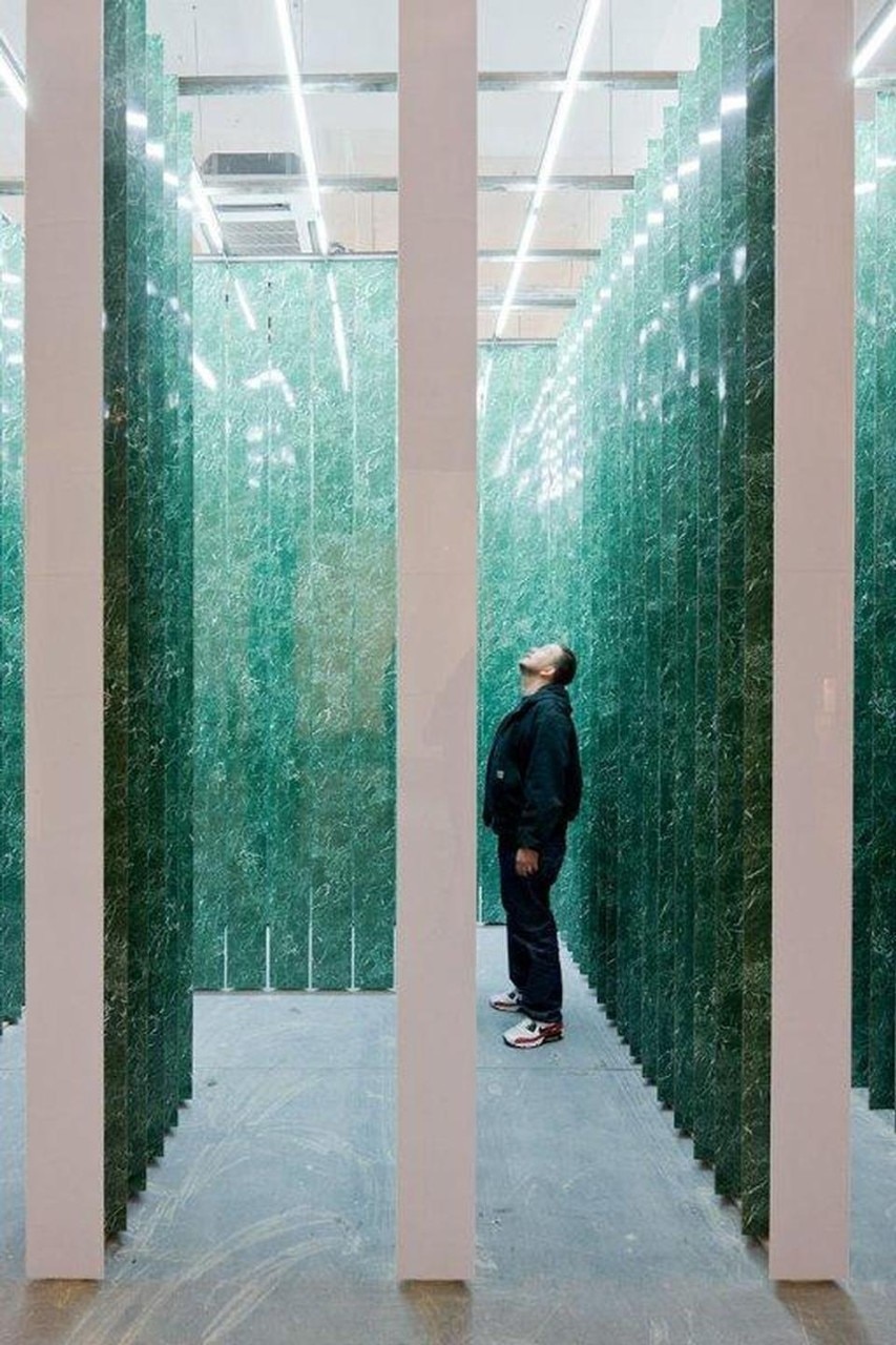 <i>Tricolonnade</i> is a façade of negative space implying six green marble fluted columns