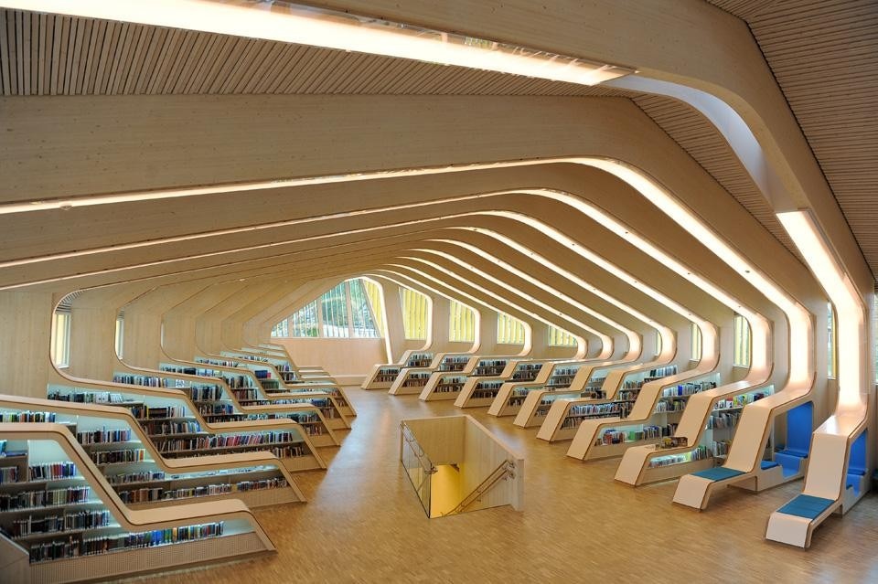 Each of the library's ribs includes a reading nook integrated with bookshelves 