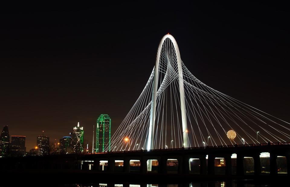 A night view of Santiago Calatrava's Margaret Hunt Hill Bridge in Dallas. Top: Photo by Marco Becerra. Above: Photo by Dana Driensky