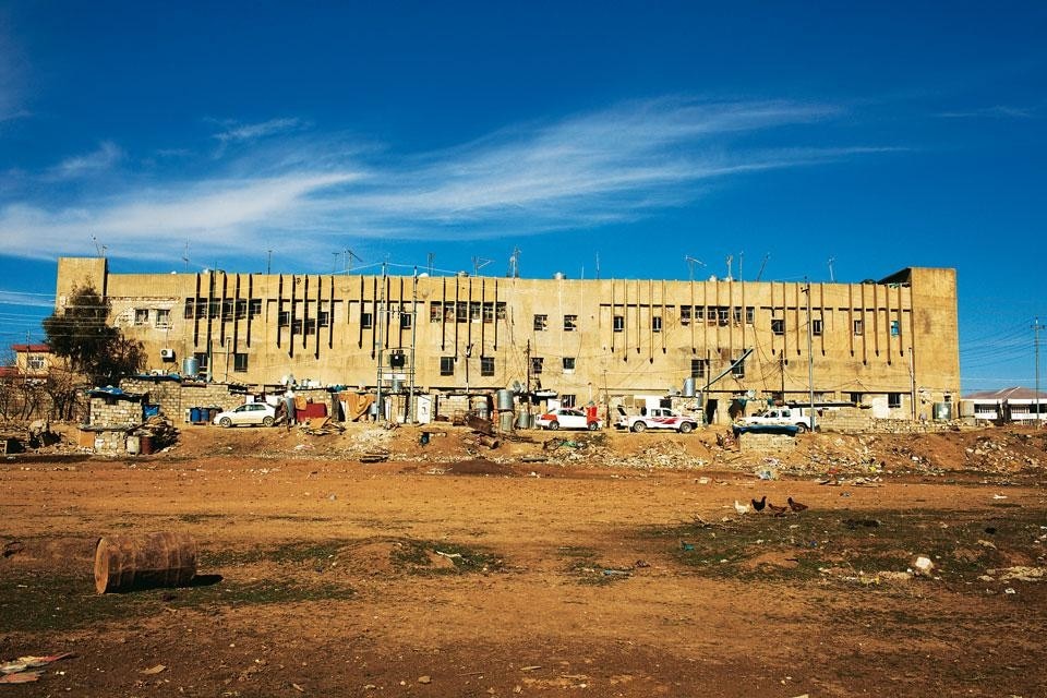 Exterior of a building in
the village of Raparin, a
former industrial complex
for weapons and munitions
production that is now
inhabited by 70 families