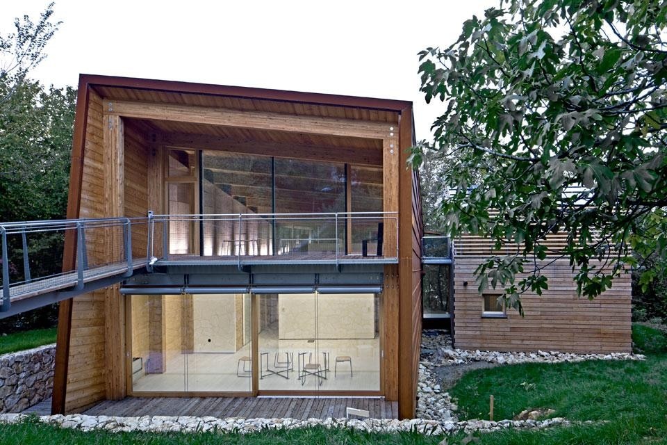 Top and above: the Tvzeb building’s north façade. A suspended walkway provides access to the office