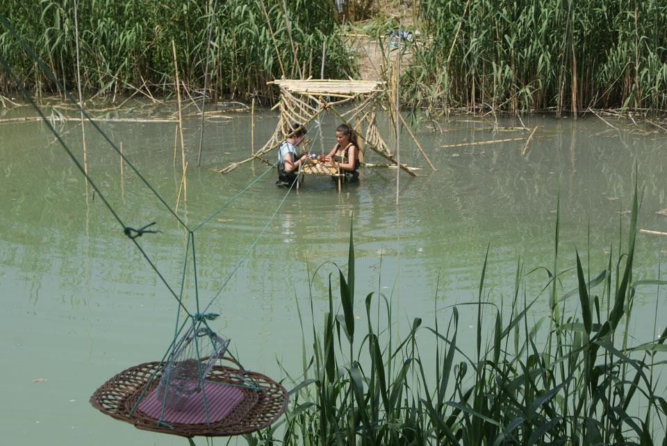 <em>Breakfast with fishing</em>; This involves finding the best possible way of crossing the river, depending on the particular conditions of the mud and rushes along the banks, in order to have breakfast with the Sunday morning fishermen on the opposite river bank <em>Breakfast with fishing</em>; This involves finding the best possible way of crossing the river, depending on the particular conditions of the mud and rushes along the banks, in order to have breakfast with the Sunday morning fishermen on the opposite river bank