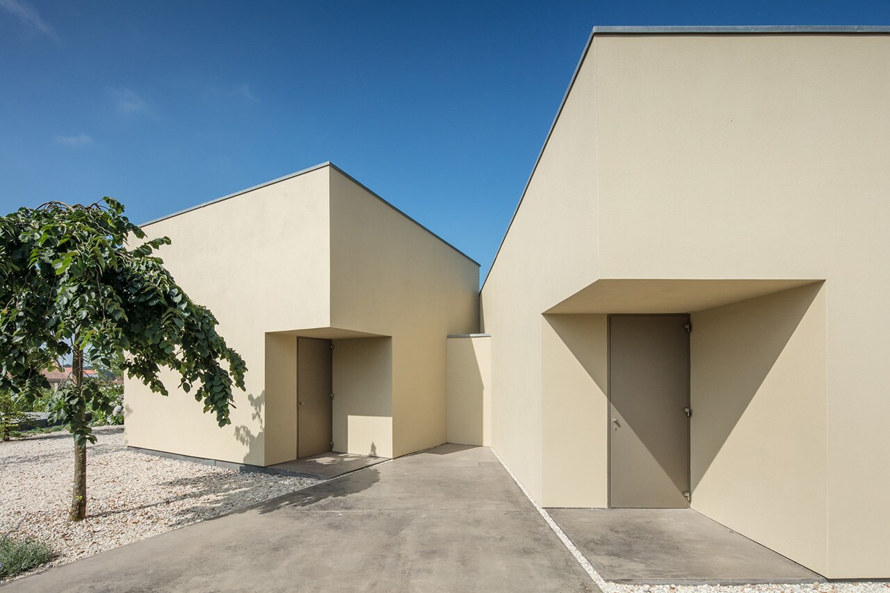 A cube, cuboid and cylinder intersect to create architecture studio in ...