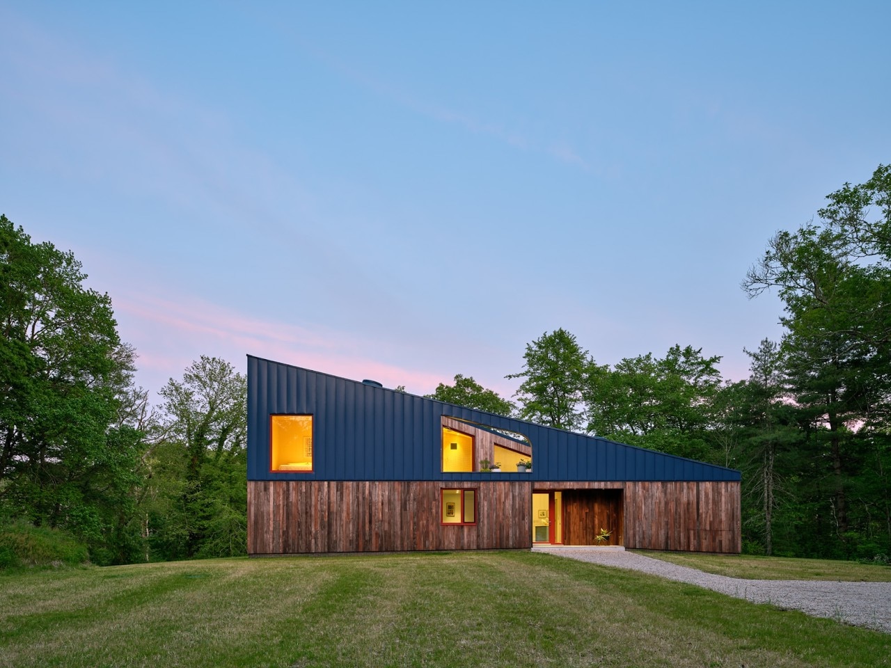 Nestled in a Rhode Island woods is a blue-roofed house created by the people who live and pass by it