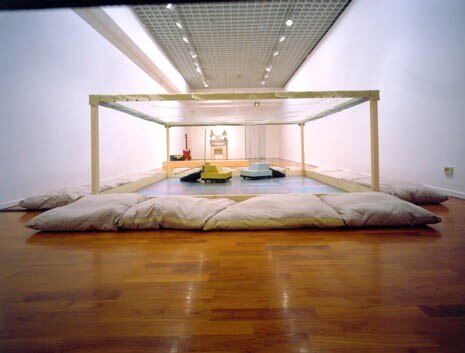"Tempesta", installation with two wooden floor polishers, iron support, cushions and electric mechanism, 2002
