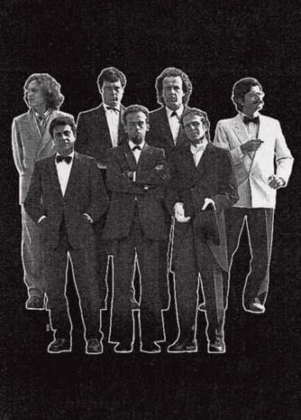 The poster for the “Sieben aus Italien” exhibition, by seven artists at Basle in 1989. The five in black are Paladino, Clemente, De Maria, Chia and Cucchi, on left, Luigi Ontani, on the right Ernesto Tatafiore