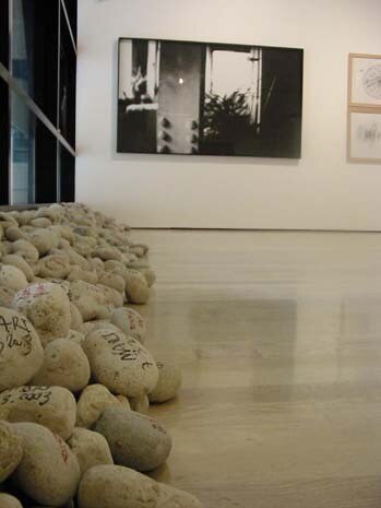 Twenty five black and white images by Emanuel Dimas Melo de Pimenta portray John Cage’s loft